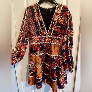 Unused short dress with long sleeves.